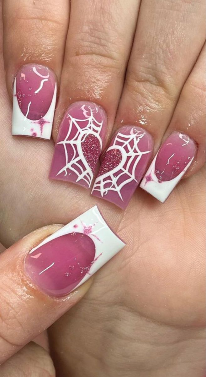 Whimsical Pink and White Nail Design with Spiderweb Patterns and Heart Accents