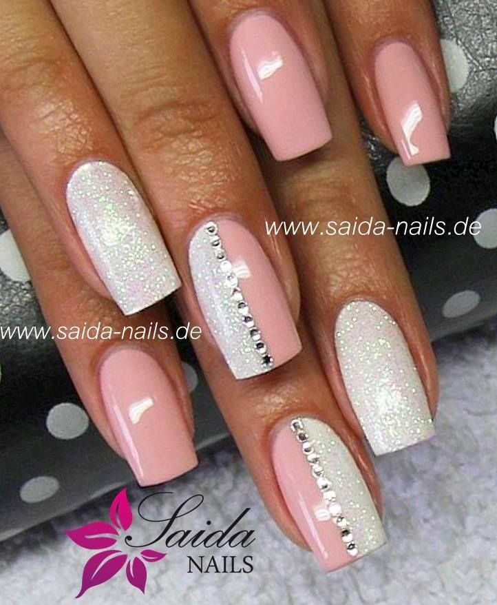 Chic Soft Pink Nail Design with Glitter and Rhinestone Accents.