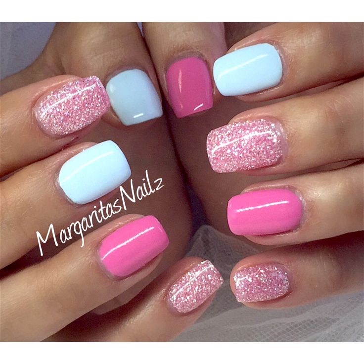 Playful Pastel Nail Design with Glittering Pink Accents for a Cheerful Look.