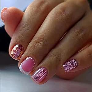 Stylish Nail Design: Playful Pink Shades with Unique Patterns and Shimmering Accents.