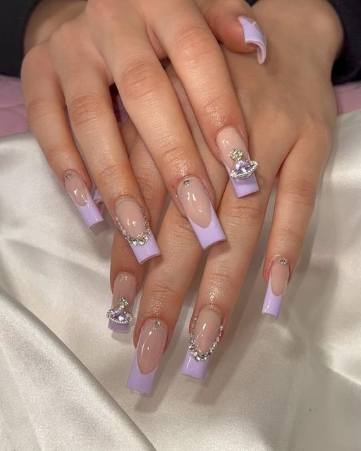 Chic Lavender Gradient Long Acrylic Nails with Gemstone Accents and Intricate Art.