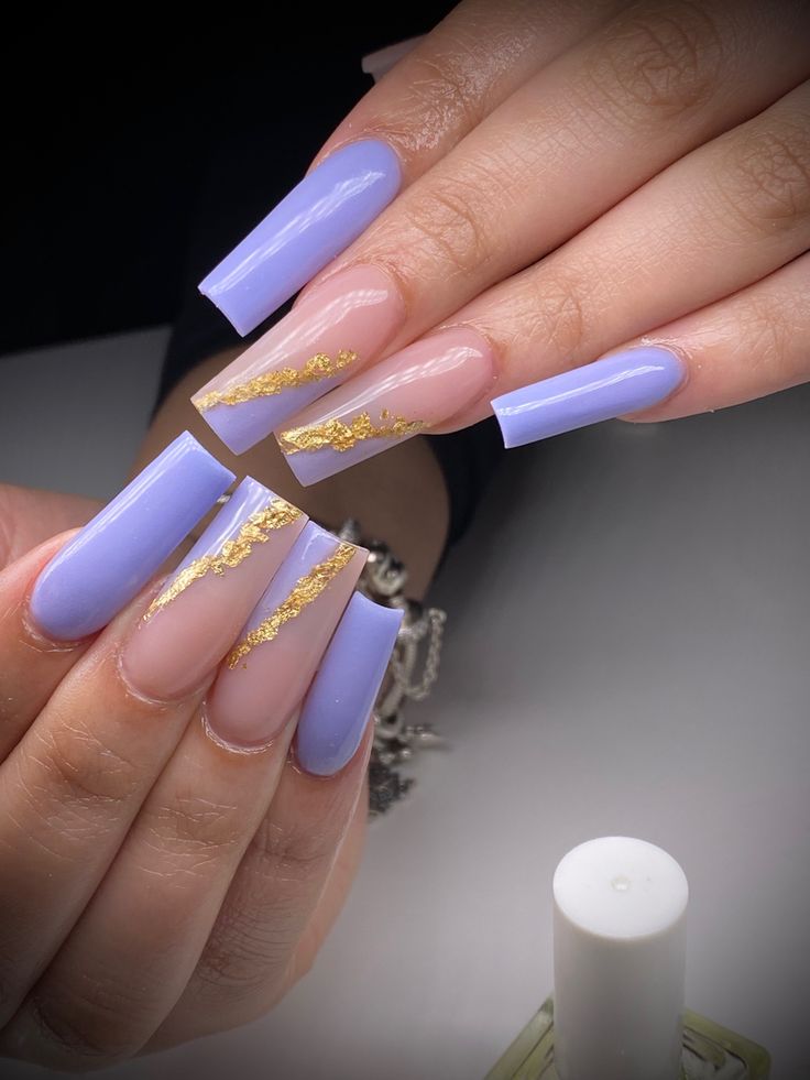 Elegant Lavender Almond Nail Design with Gold Foil Accents.