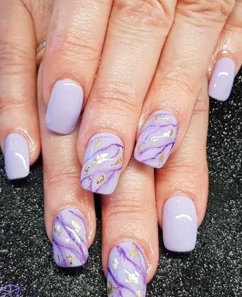 Elegant Lavender Nail Design with Glossy Finish and Gold Accents.