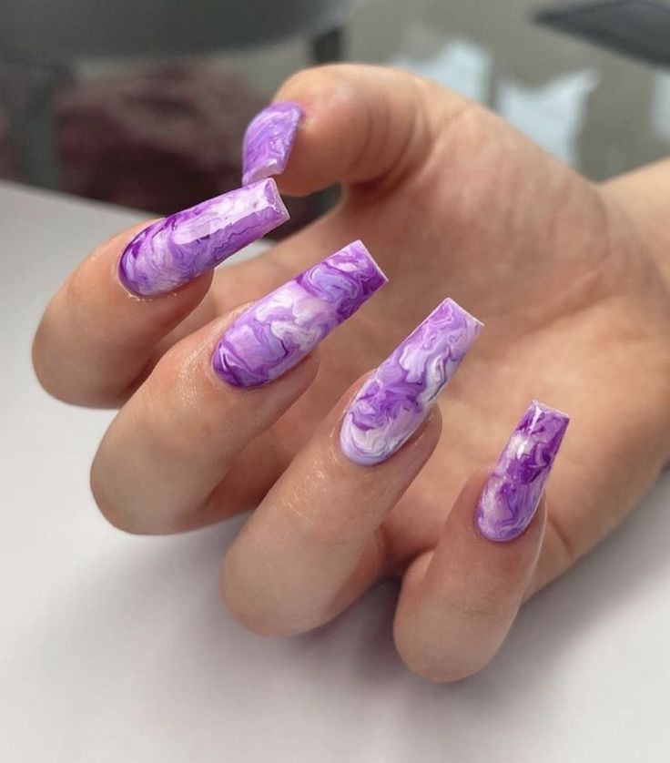 Bold Purple Marbled Nail Design with Intricate Swirls and Glossy Finish.