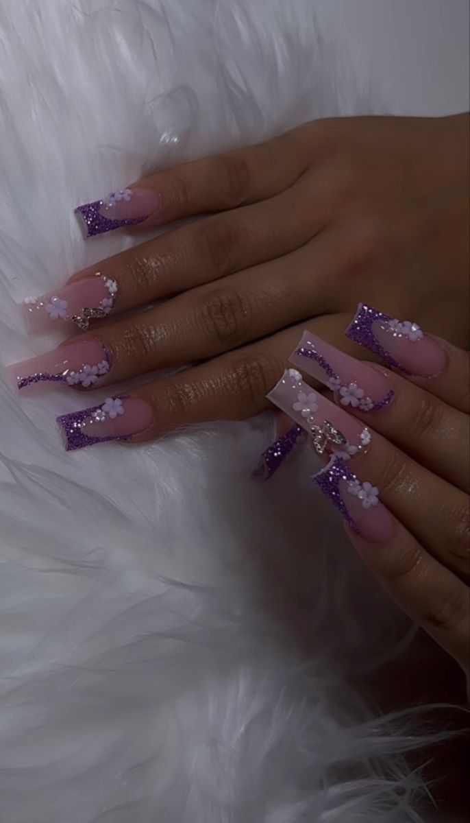 Chic Purple Glitter Acrylic Nails with Floral Accents on Nude Base