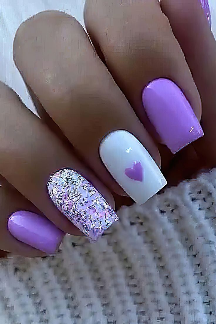 Playful Pastel Nail Design with Glitter Hearts for a Sweet and Stylish Look.