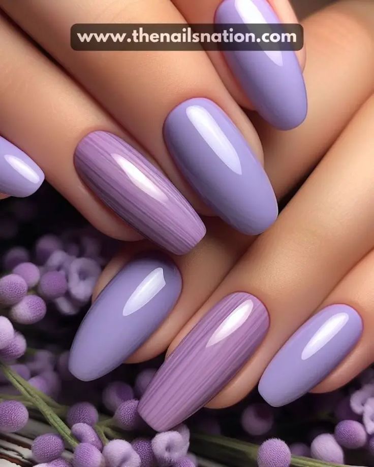 Chic Lavender Nail Design with Glossy Finishes and Textured Accents.