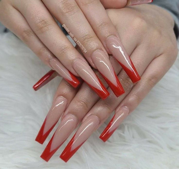 Bold Red-Tipped Almond Nails: A Chic Fusion of Sophistication and Flair