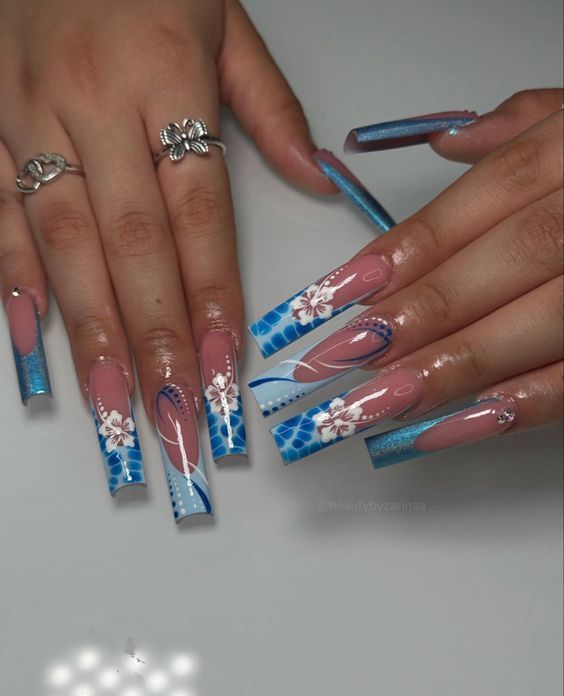 Vibrant Blue and Pink Floral Nail Design: A Stunning Expression of Elegance and Artistry.