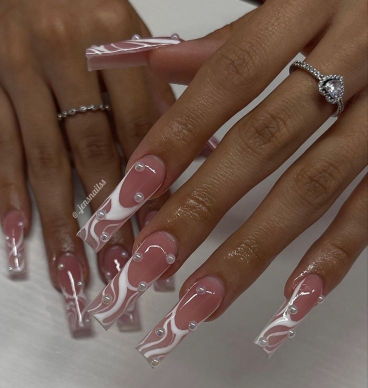 Chic Soft Pink and White Swirled Long Acrylic Nails with Gem Accents