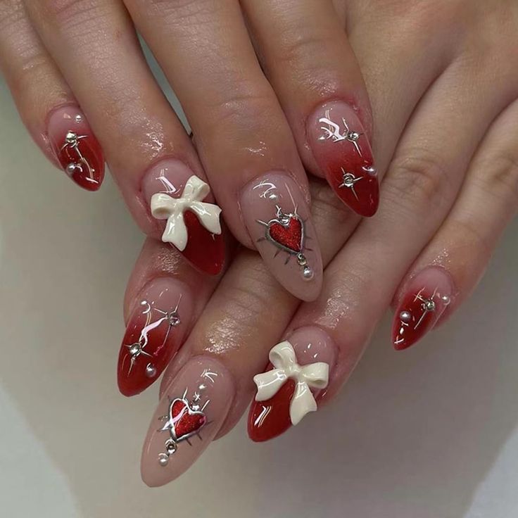 Charming Romantic Nail Design with Playful Red and Nude Tones, Glossy Hearts, and Silver Accents.