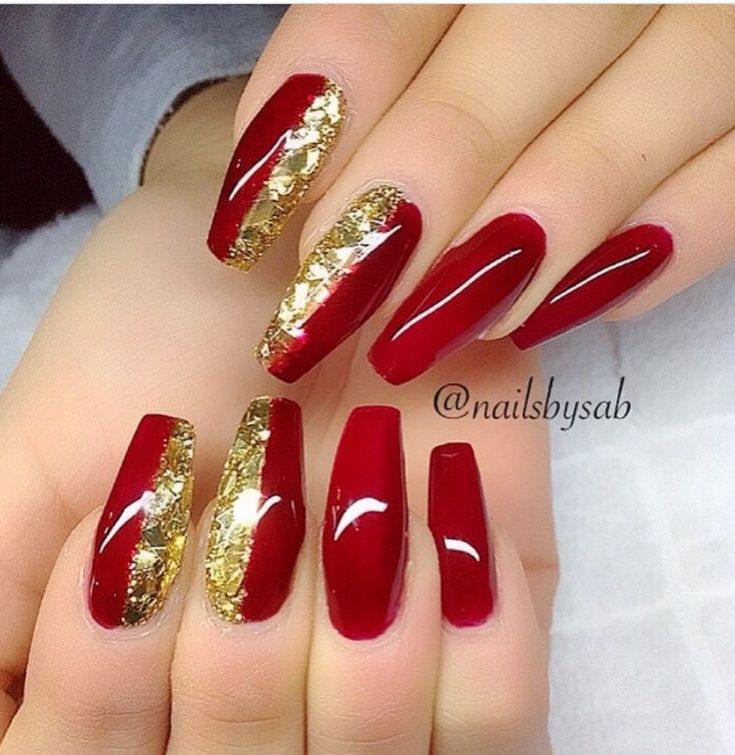 Glamorous Elegant Red Nails with Shiny Finish and Gold Foil Accents