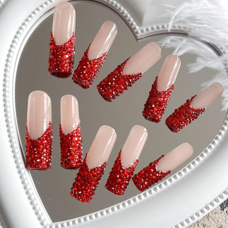 Stunning Red Glitter Nails with Elegant V-Shape Design for Special Occasions.