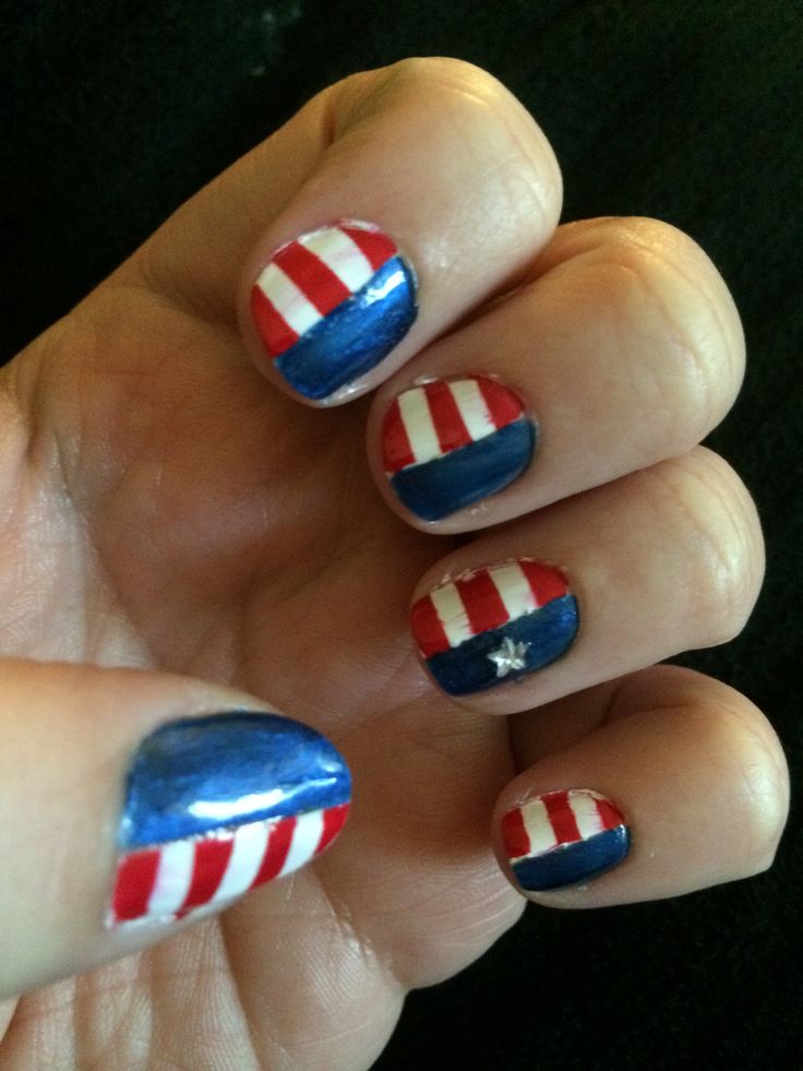 Festive Patriotic Nail Design with Stripes and Star Accents.