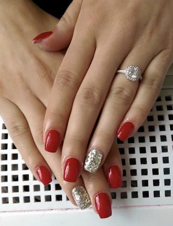 Sophisticated Elegant Red Nails with Dazzling Silver Glitter Accent.