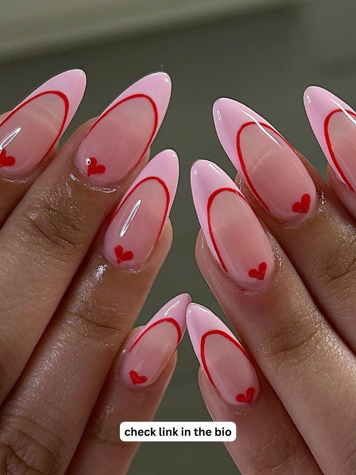 Elegant Heart-Themed Nail Design: Soft Pink Base with Glossy Finish and Delicate Red Accents.