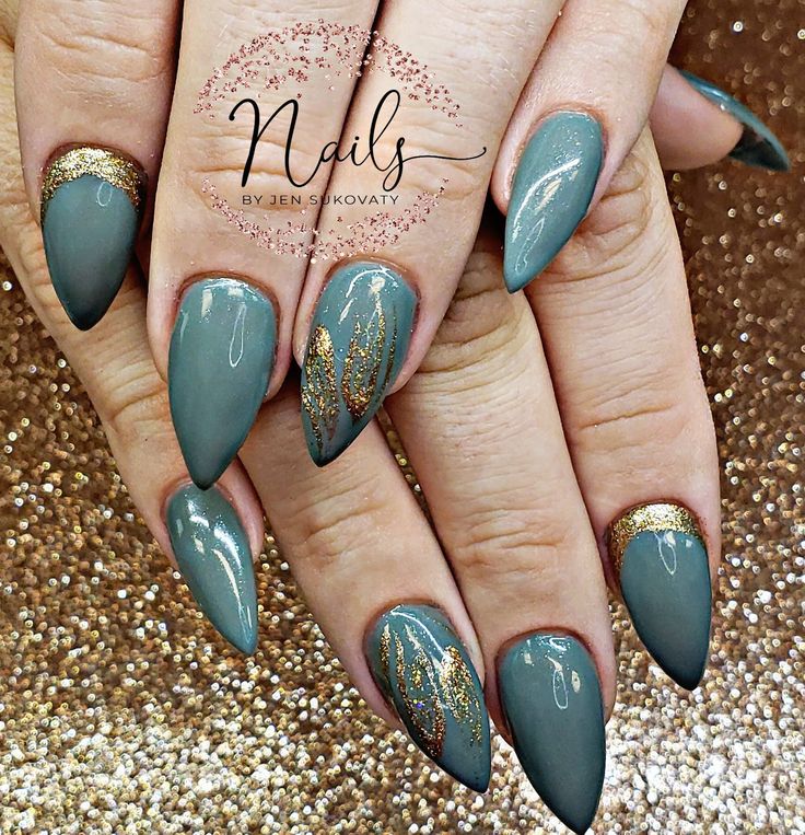 Elegant Almond-Shaped Nails: Muted Green Polish with Gold Accents and Abstract Designs for a Trendy Look.