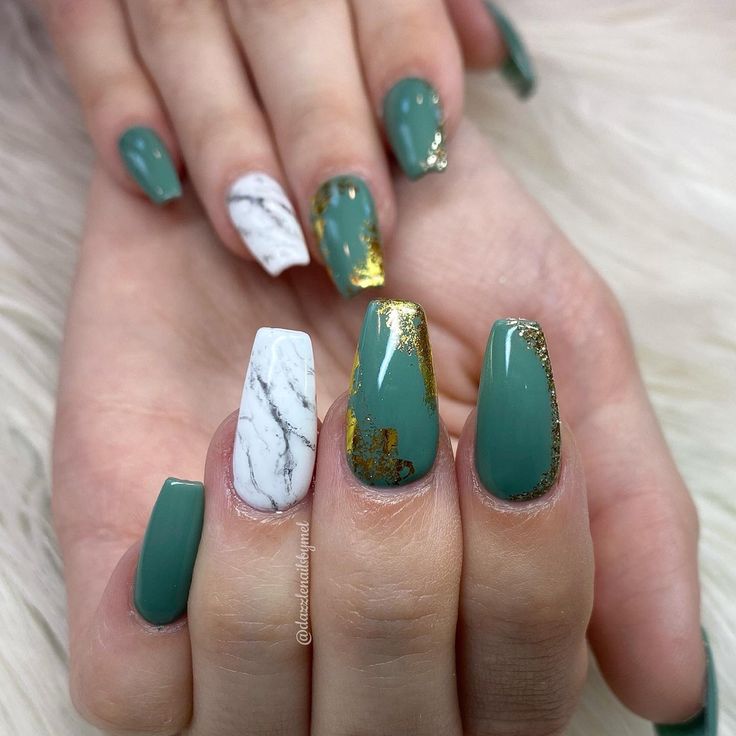 Sophisticated Deep Green Nail Design with Marble and Gold Accents.