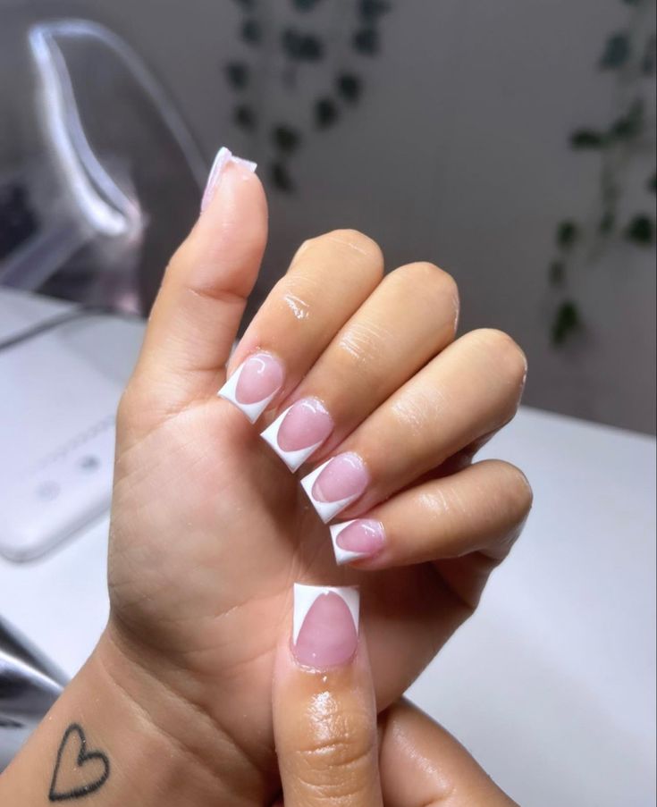 Sophisticated Modern French Manicure with Elegant White Tips and Natural Pink Base.