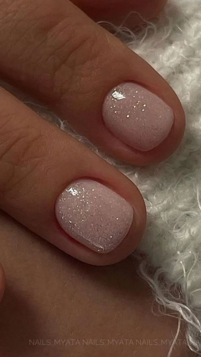 Elegant Pink Nail Design with Soft Glossy Finish and Subtle Shimmer.