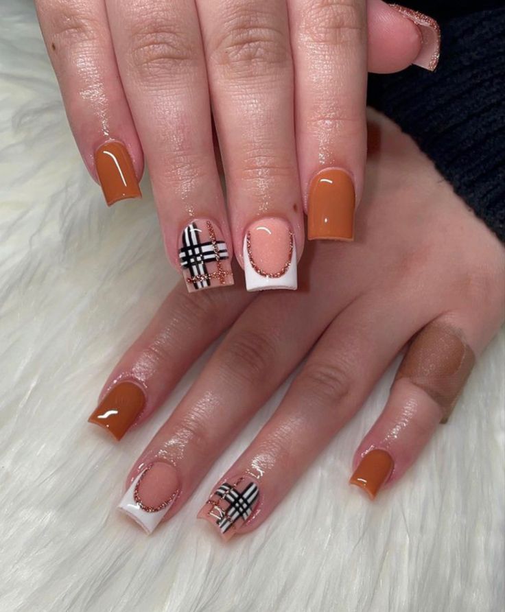 Contemporary Chic: Stylish Nail Design with Warm Brown and Classic White Accents.