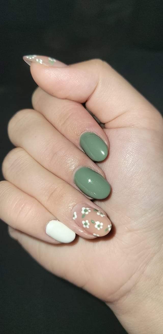 Modern Chic Nail Design: A Whimsical Blend of Matte, Glossy Finishes, and Floral Accents in Olive Green and Pastel Tones.