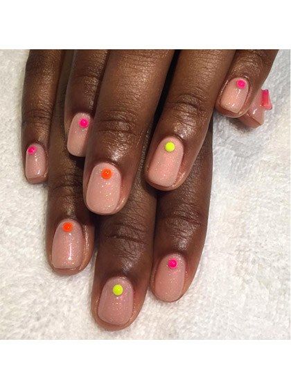 Elegant Nude Nail Design with Vibrant Colored Dots for Versatile Style.