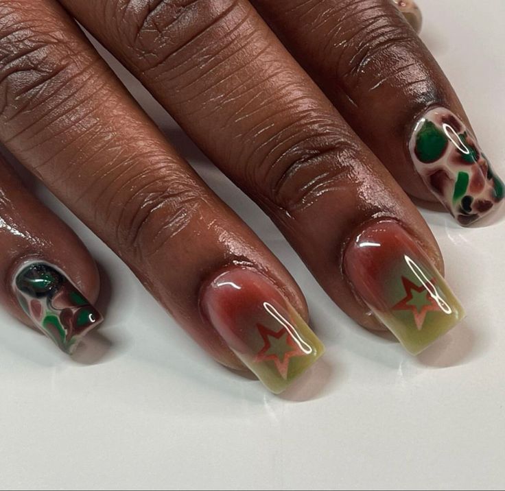 Bold Earthy-Toned Nail Design with Artistic Patterns and Glossy Finishes