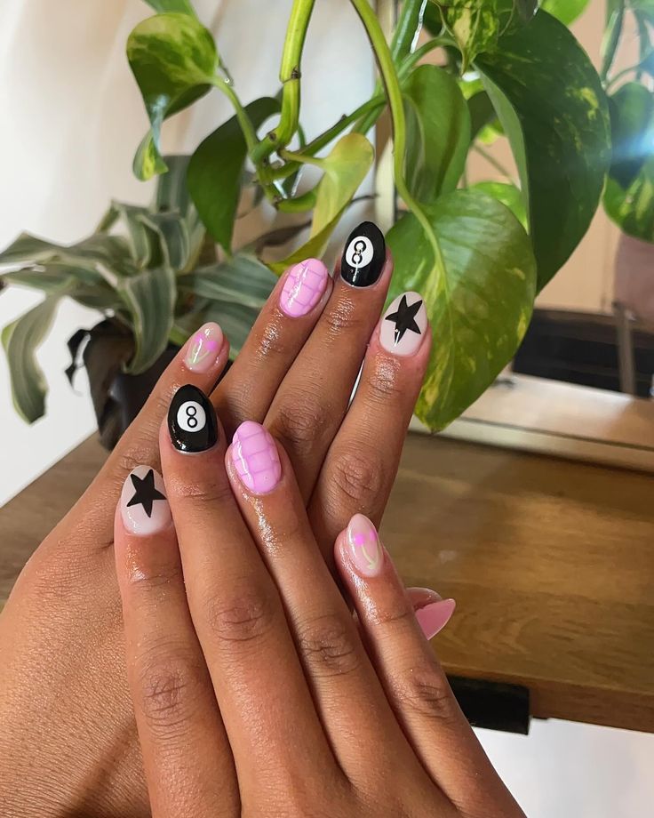 Vibrant Nail Art: Glossy and Matte Black-Pink Designs with Geometric and Star Motifs