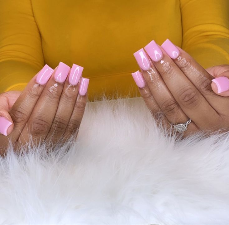 Chic Glossy Pink Nail Design with Modern Square Tips and Subtle Detailing.