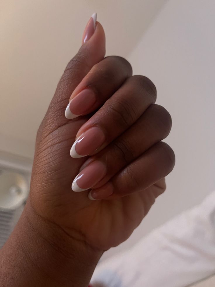 Sophisticated Almond-Shaped French Tip Nails: Timeless Elegance for Any Occasion.