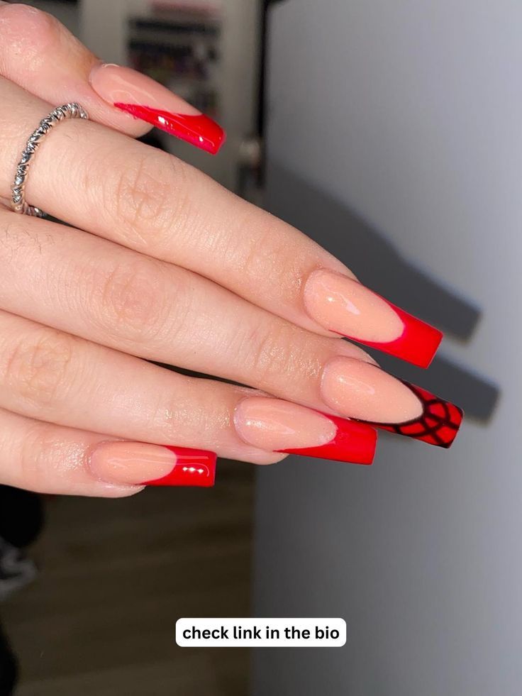 Bold and Chic: Glossy Red Long Square Nail Design with Playful Black Web Accent