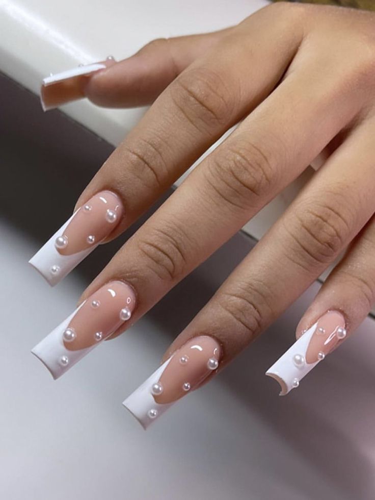 Chic Nude and White Pearl-Tipped Nail Design: A Blend of Minimalism and Glamour.