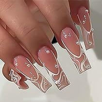 Chic Gradient Nail Design with Artistic Swirls and Rhinestone Accents.