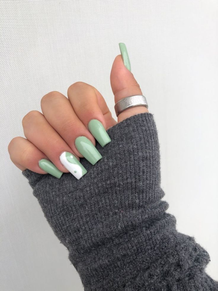 Trendy Mint Green Nail Design with Creative Accent Detail.