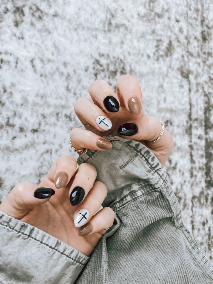 Chic Matte and Glossy Earth-Toned Nail Design with Unique Accent Symbols.