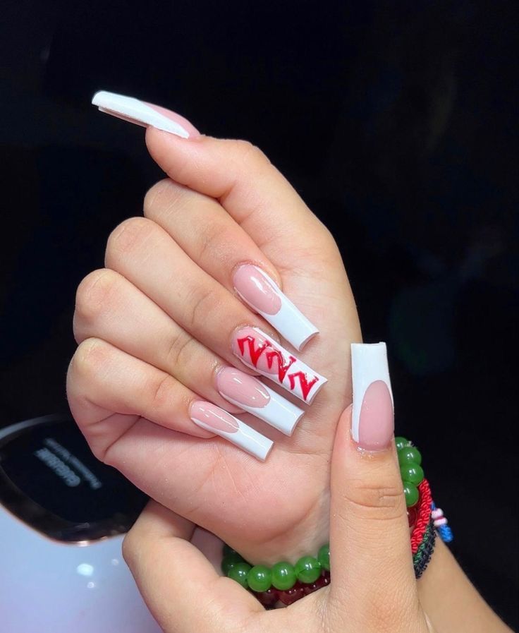 Chic Long Nails: Glossy White and Soft Nude with Bold Red Accent Design