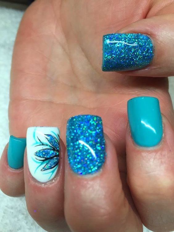 Elegant Turquoise Nail Design with Glossy, Glitter Finishes and Floral Accent