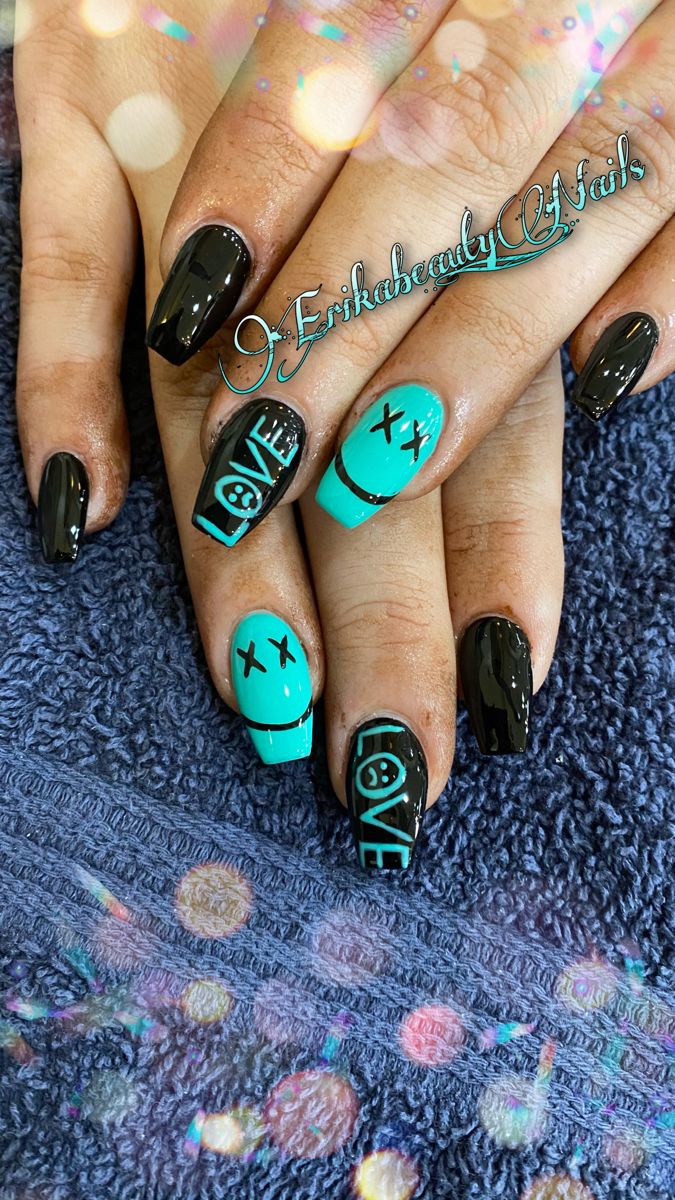 Bold Black and Turquoise Nail Art: A Playful Statement Design.