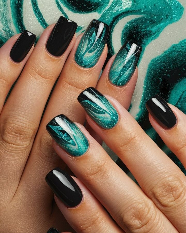 Striking Black and Turquoise Gradient Nail Design with Marbled Swirls and Shimmering Accents.