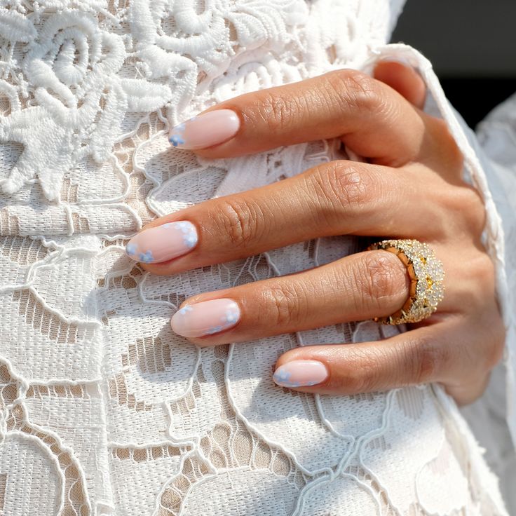 Elegant Pastel Nail Design with Ombre Effect and Sparkling Accent Ring