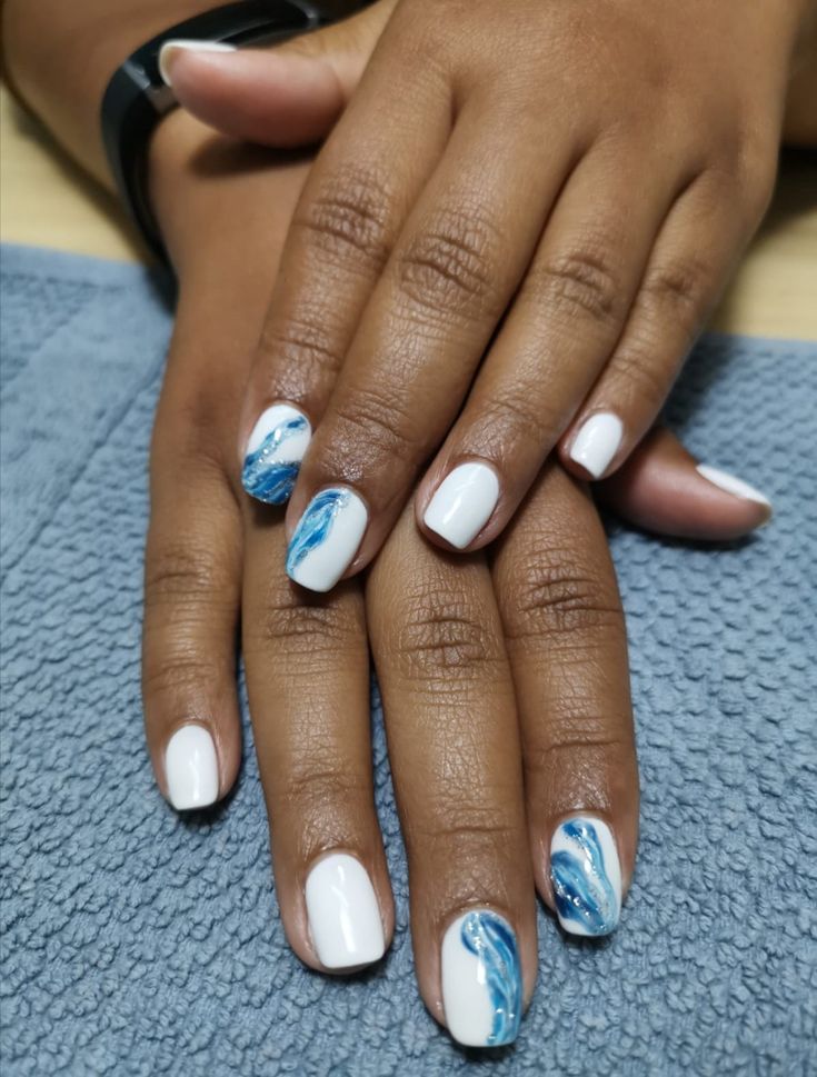 Elegant White and Blue Marbled Nail Design Inspired by Ocean Waves