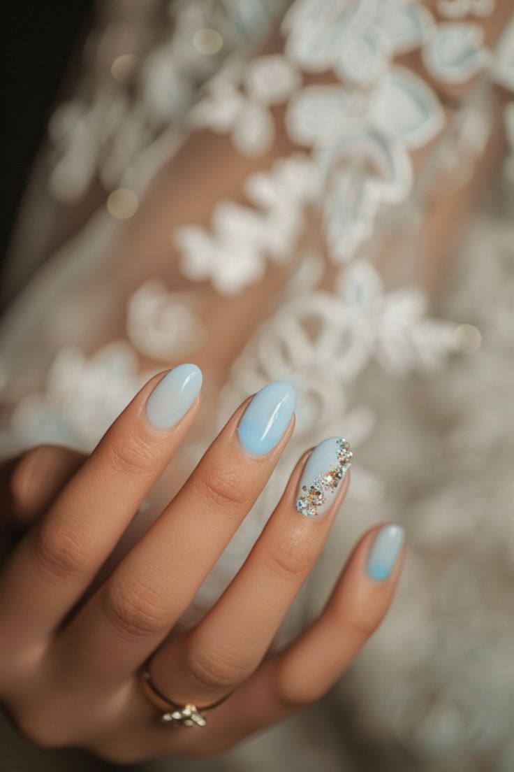 Sophisticated Pastel Blue Nails with Rhinestones: A Captivating Look for Special Occasions