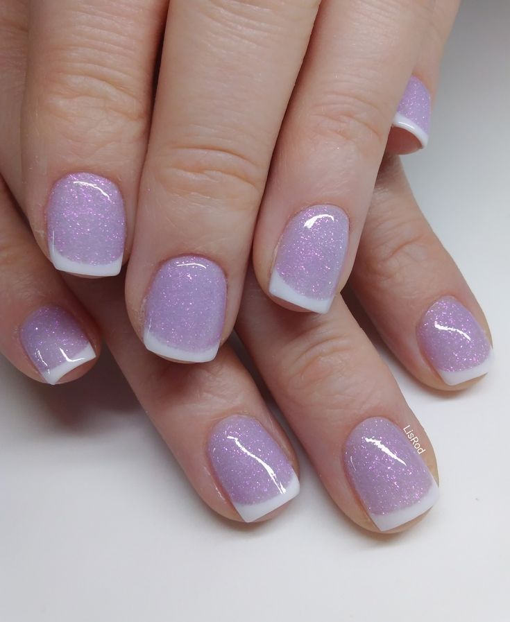 Elegant Glittery Lavender Nails with Classic White Tips: A Chic and Playful Manicure.