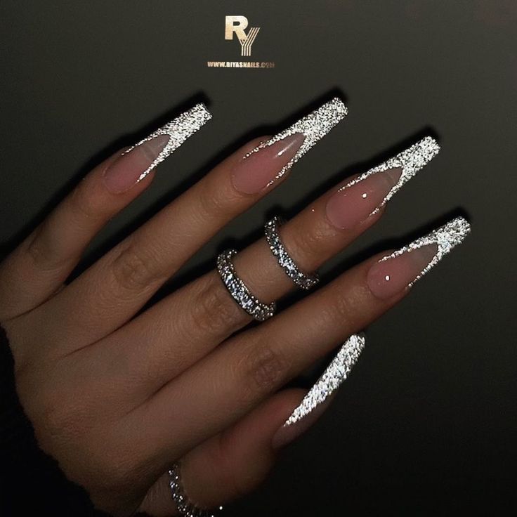 Sophisticated Nail Design: Shimmering Glittery Silver Tips on a Subtle Nude Base