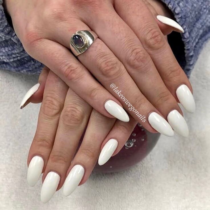 Sleek Elegant Almond-Shaped White Nails: A Polished Touch for Every Occasion.