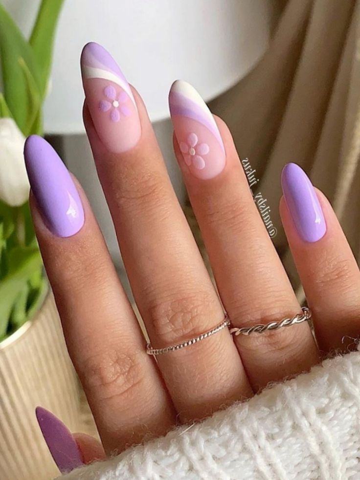 Chic Spring-Inspired Nail Design with Soft Purples and Delicate Pink Accents.