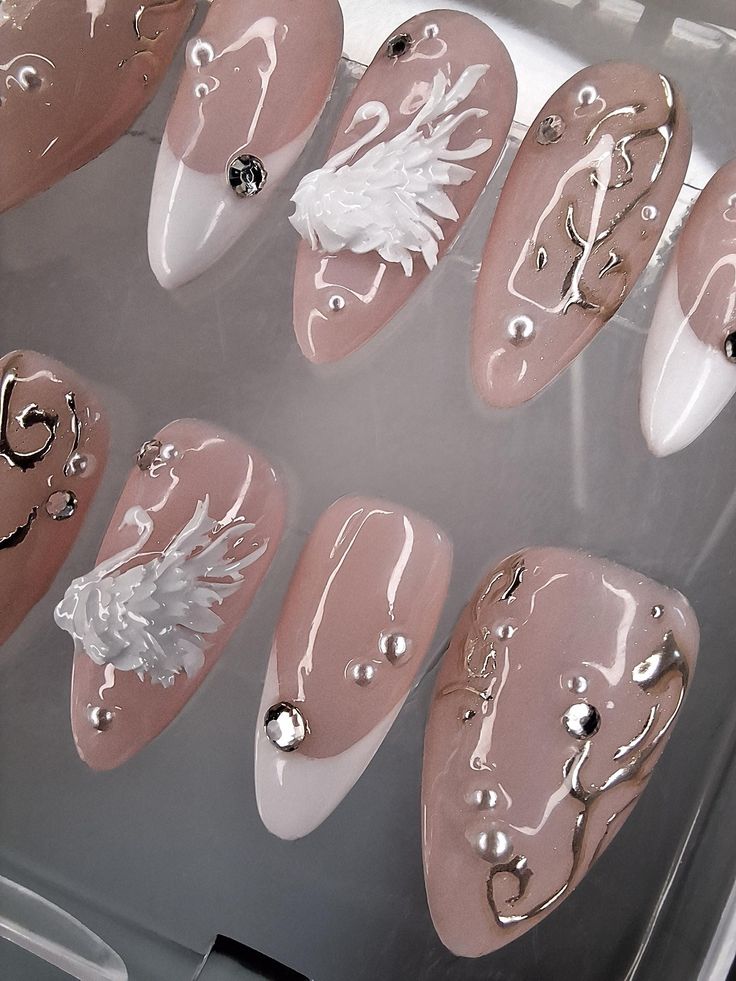 Sophisticated Elegant Nail Design with Soft Pink, White, 3D Floral Accents, and Gold Details