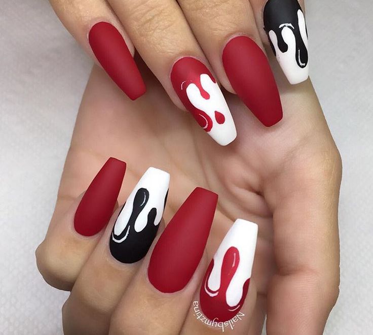 Edgy Matte Nail Design with Bold Red, Black, and White Artful Drips.