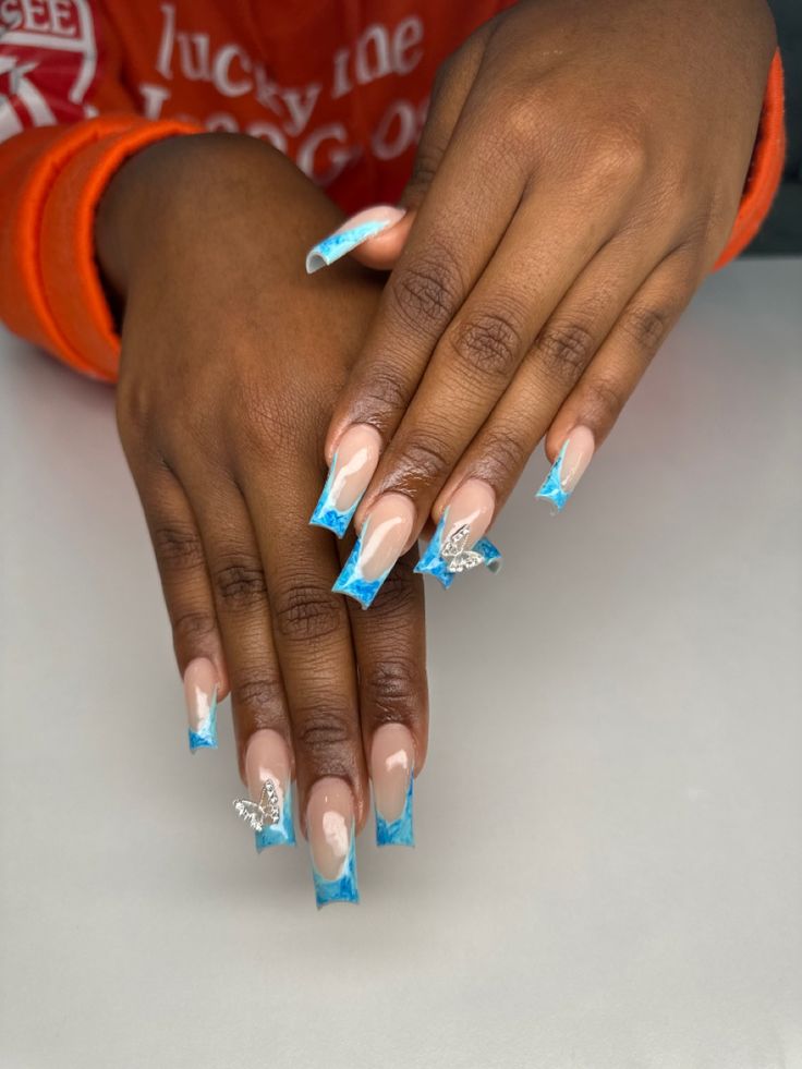 Elegant Long Nail Design in Vibrant Blue with Matte, Glossy Finishes, and Sparkling Embellishments.